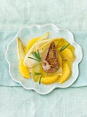 Fried calf's liver with chicory and oranges on pattern dish