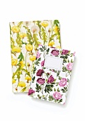 Notebooks with printed floral pattern cover on white background