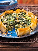 Close-up of spinach and feta cheese cake on plate