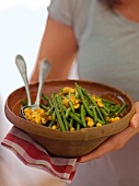 Green peas salad with peanuts in bowl