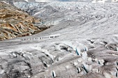 Hikers in Aletsch Glacier, Marjelesee, Valais, Switzerland