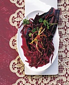 Blue cabbage salad with cranberry dressing in serving bowl