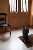 Wellington boots at entrance of door