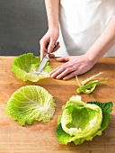 Cutting savoy cabbage leaves for preparation of cabbage rolls, step 1