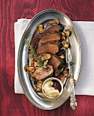 Venison with rosehip sauce in serving dish