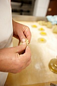 Close-up of hands forming dumplings