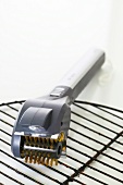 Close-up of electric grill brush