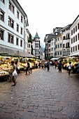 People at market in old town of Bolzano, Italy