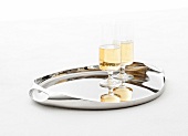 Champagne in two glasses on stainless steel tray