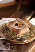 Hay flower soup in bread served on hay