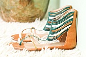 Pair of green and golden strappy sandals