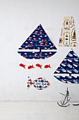 Red and blue maritime accessories on white wall