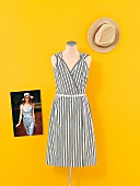 Black and white dress on mannequin and hat with catwalk photo