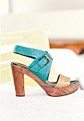 Close-up of turquoise and beige plateau sandal