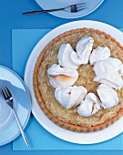 Apple-caramel pie with cream on plate