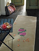 Bastmatte with rose motif and donuts on plate