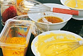 Saffron sauce, cream and olive oil emulsion in three bowls