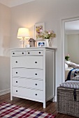 Bedroom in Scandinavian style with dresser, mirror and drawer