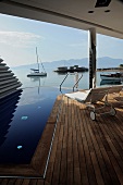 Balcony of Elounda Beach Hotel overlooking sea in Crete, Greece