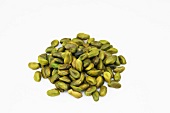 Close-up of pistachios on white background