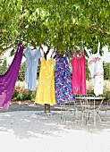 Summer dresses made of organic materials on a rope