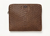 Laptop bag with reptile embossing on white background