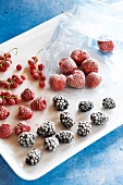 Frozen strawberries raspberries and blackberries on plate