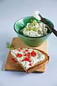 Wild garlic bread and bowl of cheese spread on wood