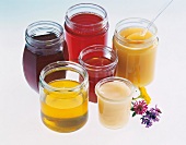 Various types of honey in glass jars