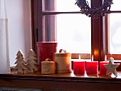 Christmas decorations with candles on the window sill