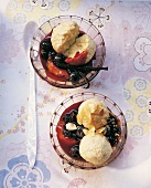 Curd dumplings with blueberry sauce in bowls