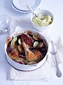 Lime chicken in a pot with a bowl of mashed potatoes