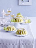Pudding with apples, grapes and vanilla sauce