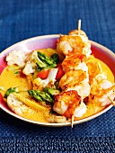 Prawn skewers with a red curry sauce
