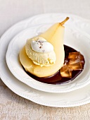 Pear helene with chocolate ganache and pear jelly on plate