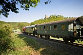 Train passing through Nature Park in Franconian Switzerland, Bavaria, Germany