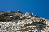 Man climbing on rock mountain at Franconian Switzerland, Bavaria, Germany