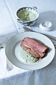 Roast beef with remoulade sauce on plate