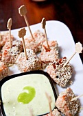 Close-up of diced salmon with sesame wasabi sour cream on plate