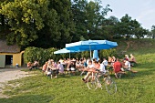 Tourists dining in Nature Park, Franconian Switzerland, Bavaria, Germany