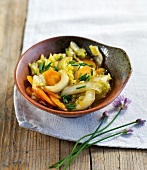 Chinese cabbage and carrots with chives in bowl