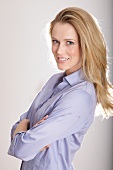 Portrait of beautiful blonde woman wearing shirt, smiling