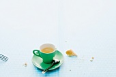 Cup of tea with bread crumbs