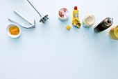 Kitchen utensils and spices on white background