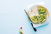 Zucchini omelettes on butter paper with knife