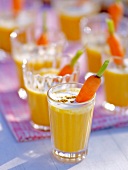 Close-up of cream of carrot soup in glasses