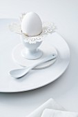 An old-fashioned doily as an egg cup decoration