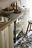 White screen made of cotton before shelf under sink in kitchen