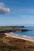 View of Antrim coast and sandy bay, Ireland, UK