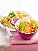 Bowl of curry chicken with mango and shredded turkey on plate